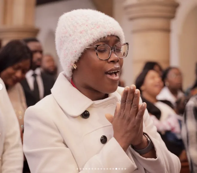 A woman praying during worship